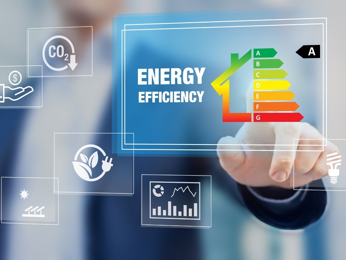 A finger pressing a digital image of saving energy