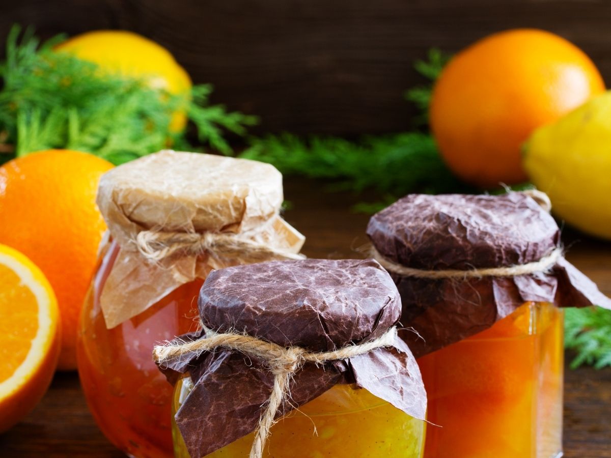 lemons and oranges as fruits as well as preserved in jars